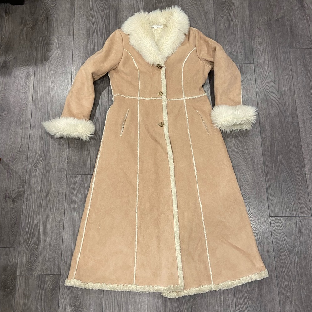 Vintage faux fur long button up jacket. Great condition.